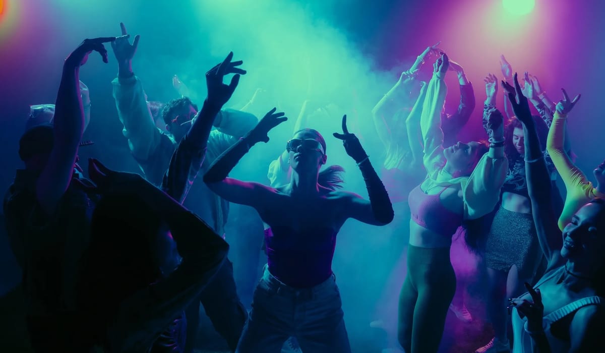 DJ performance with dramatic spotlight